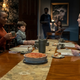Hannah, Miles, Owen, and Flora welcome Dani to dinner.